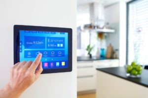 home-automation-device-with-kitchen-blurred-in-background