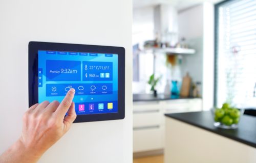 home-automation-device-with-kitchen-blurred-in-background