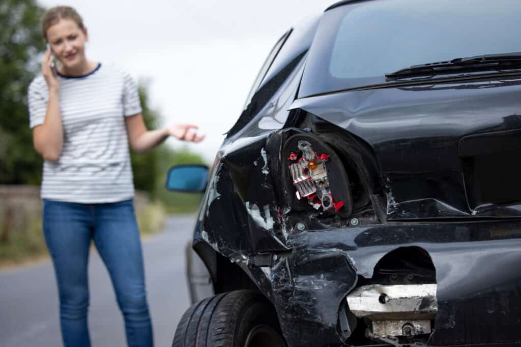 woman figuring out what to do after a car accident