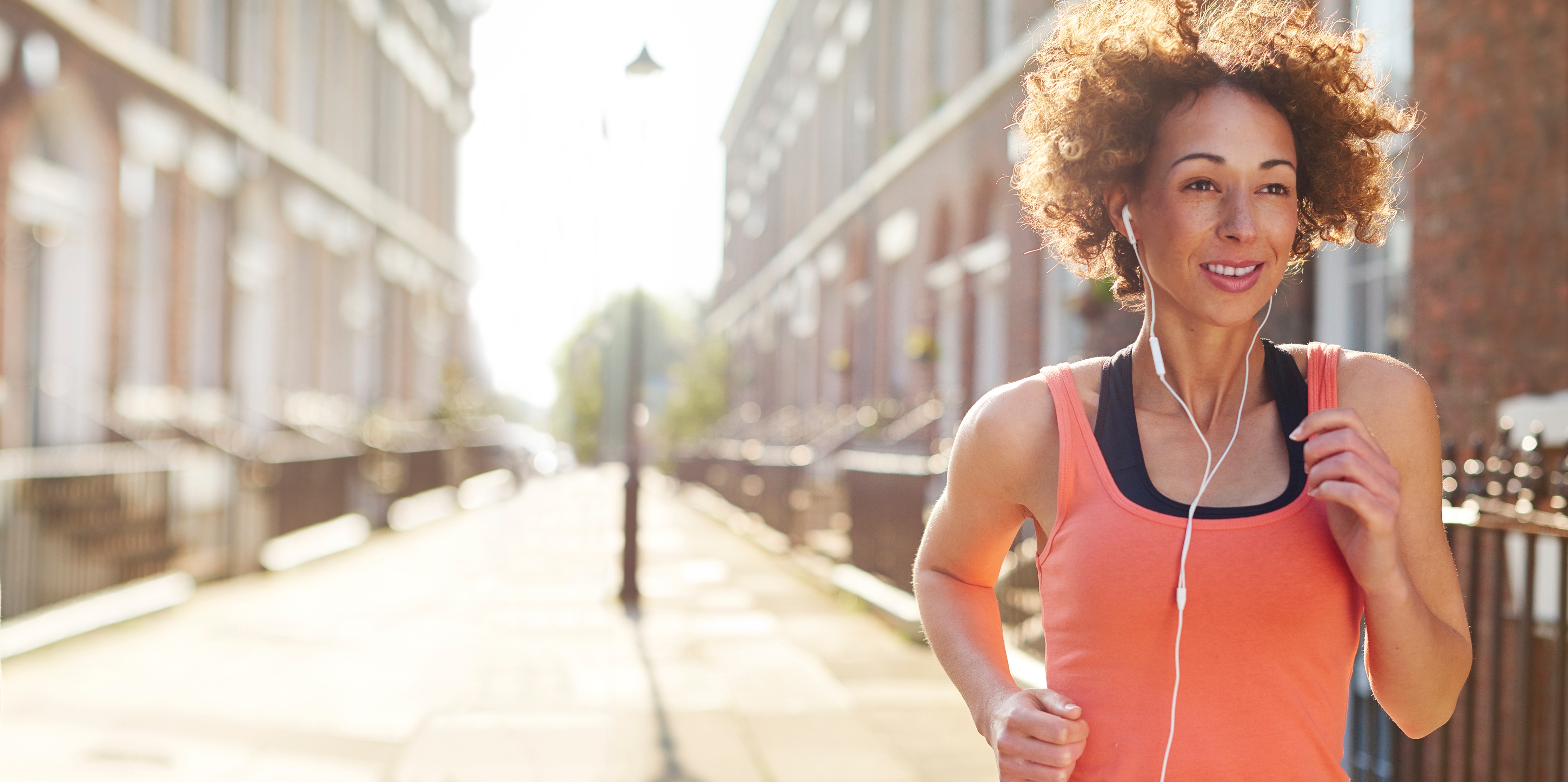 woman-jogging-in-city-on-sunny-day