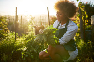 african american woman in community garden