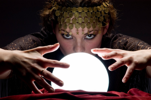 psychic-looks-into-glowing-crystal-ball